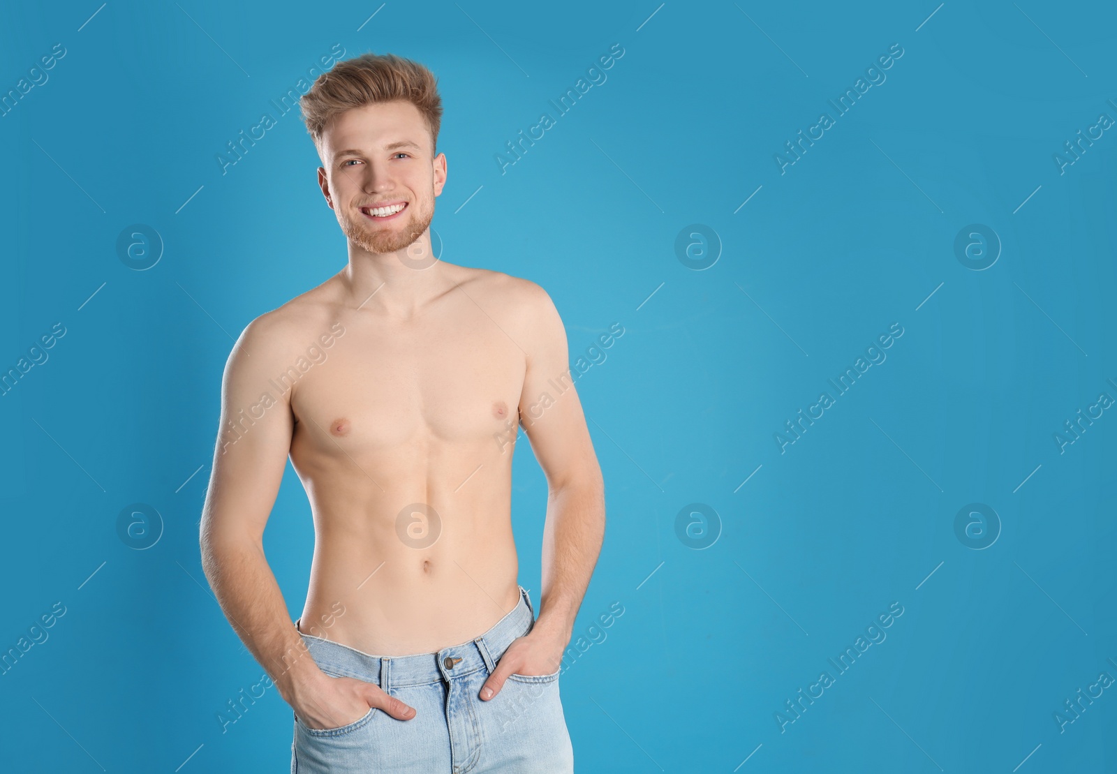 Photo of Handsome man with slim body on color background. Space for text