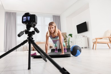 Fitness trainer recording online classes at home