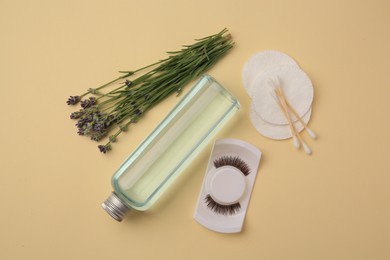 Photo of Flat lay composition with makeup remover and lavender on yellow background