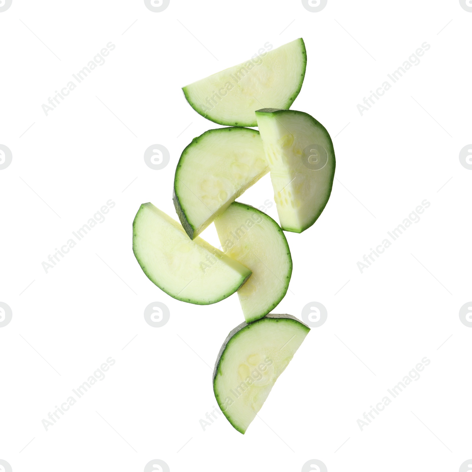 Photo of Slices of ripe zucchini on white background, top view