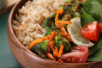 Tasty fried rice with vegetables in bowl, closeup