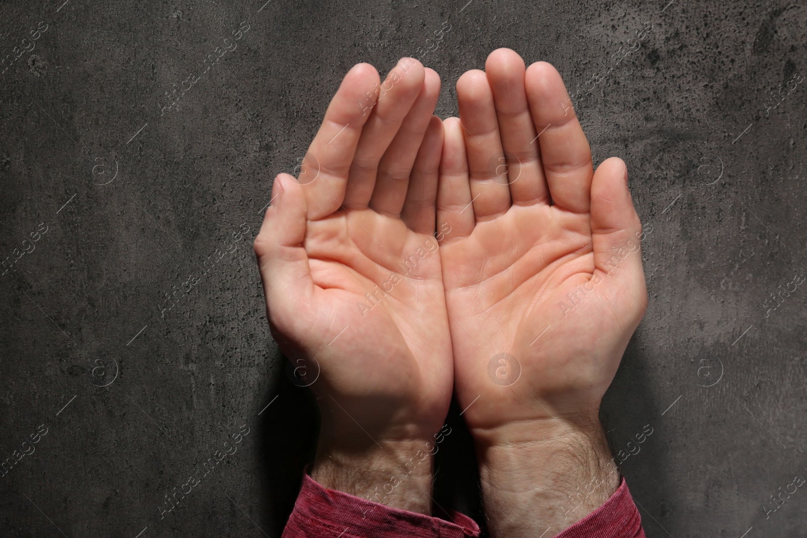 Photo of Man showing palms at table, top view. Chiromancy and foretelling