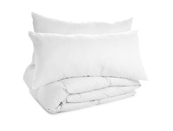 Photo of Soft blanket and pillows on white background