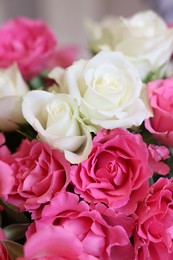 Photo of Beautiful bouquet of roses on blurred background, closeup