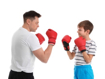 Photo of Dad and his son with boxing gloves on white background