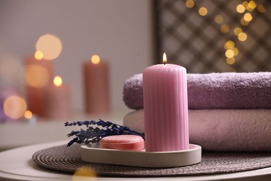 Beautiful composition with different spa products on table against blurred lights