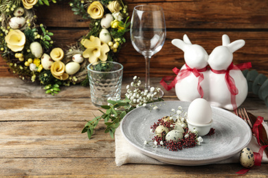 Festive Easter table setting with beautiful floral decor. Space for text