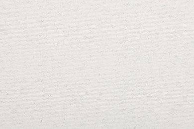 Photo of Texture of white paper sheet as background, top view