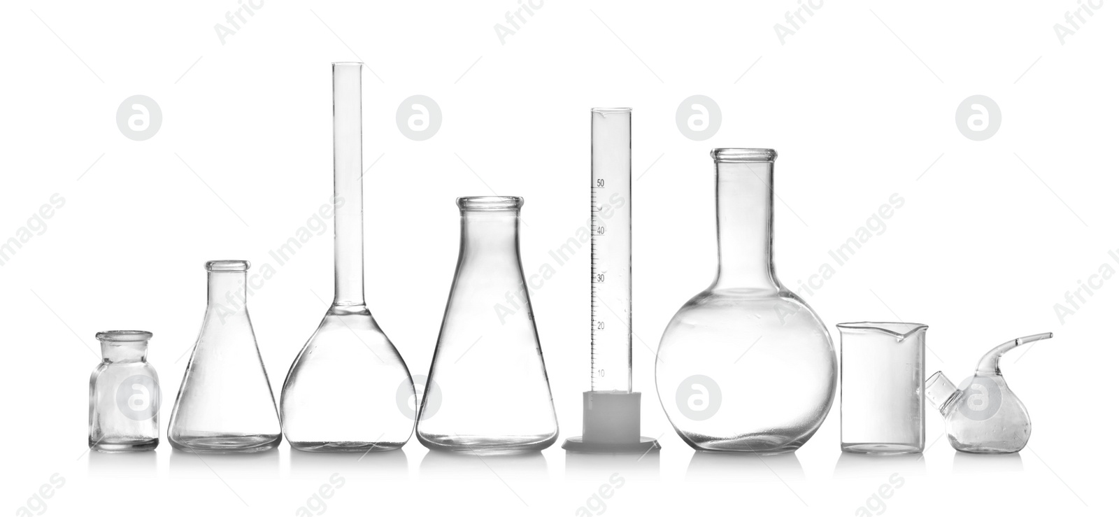Photo of Laboratory glassware isolated on white. Chemical analysis