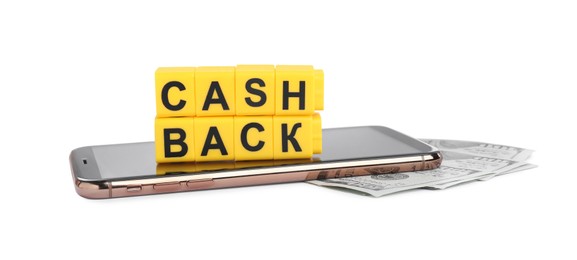 Photo of Yellow cubes with word Cashback, money and smartphone on white background