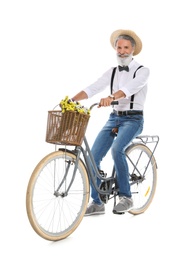 Photo of Portrait of handsome mature man with bicycle on white background