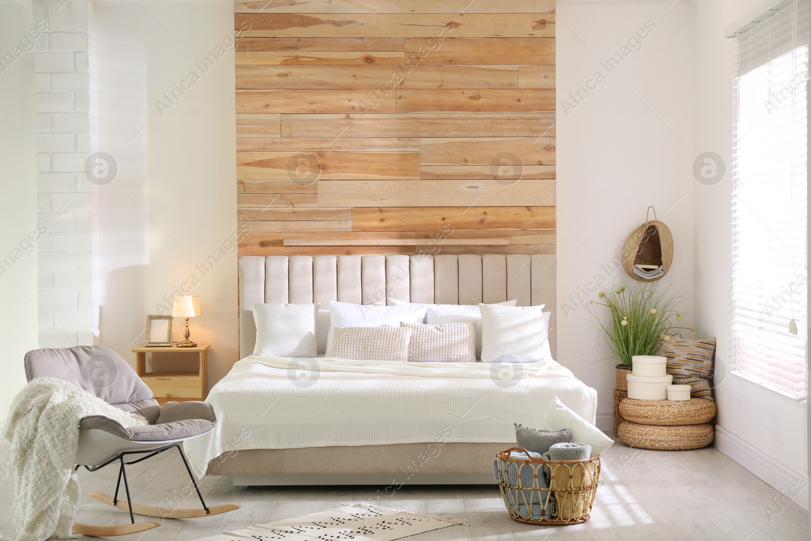 Photo of Stylish room interior with big comfortable bed