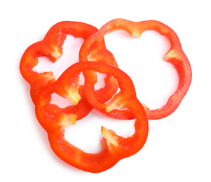 Slices of red bell pepper isolated on white