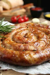 Delicious homemade sausage with spices on table, closeup