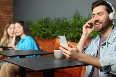 People with coffee spending time in cafe