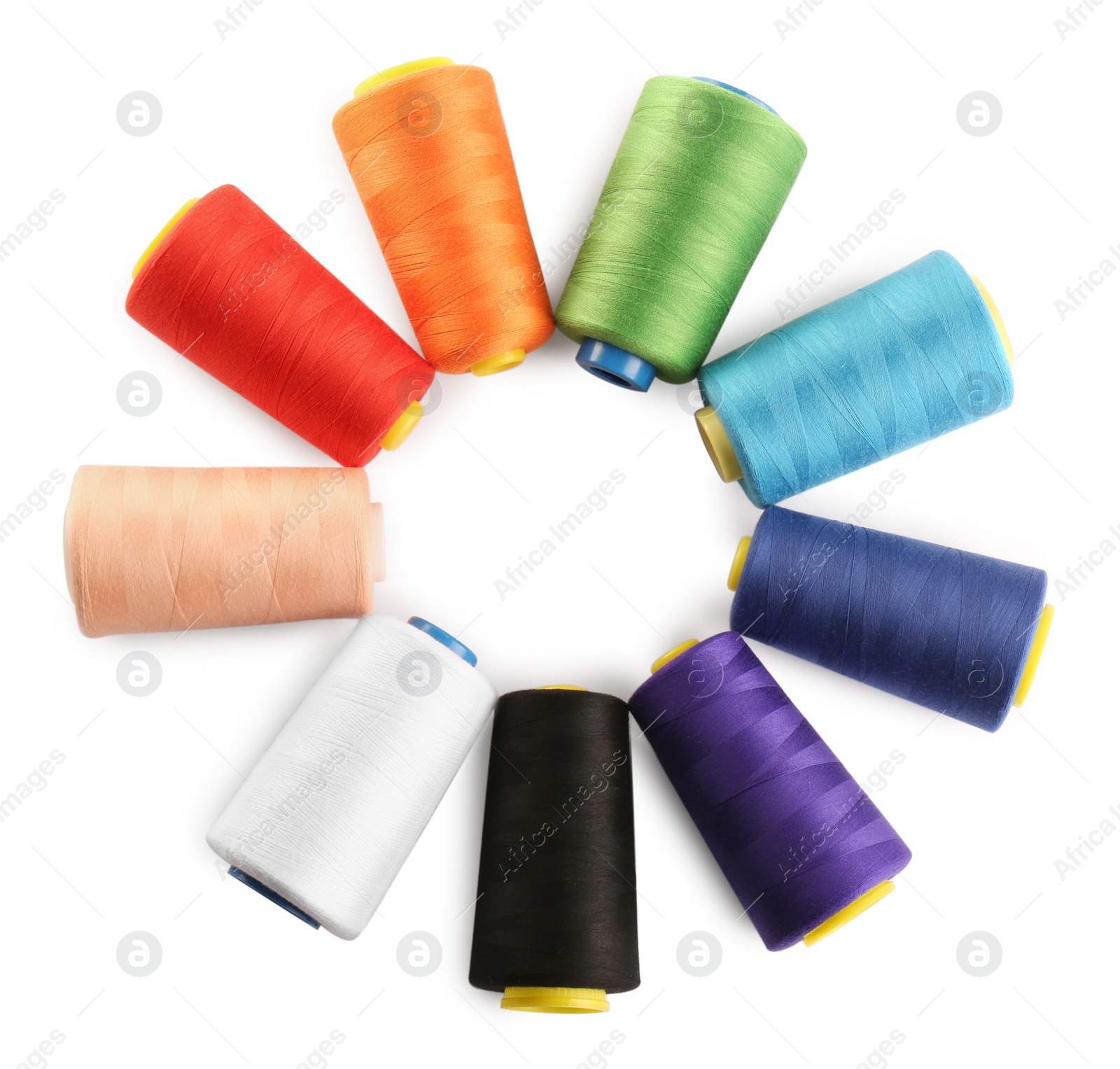 Photo of Frame of colorful sewing threads on white background, top view. Space for text