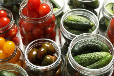 Photo of Pickling jars with fresh vegetables, closeup view