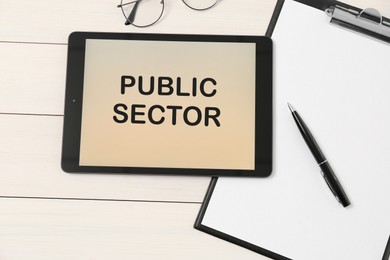Image of Public Sector. Modern tablet, clipboard and glasses on white wooden table, flat lay
