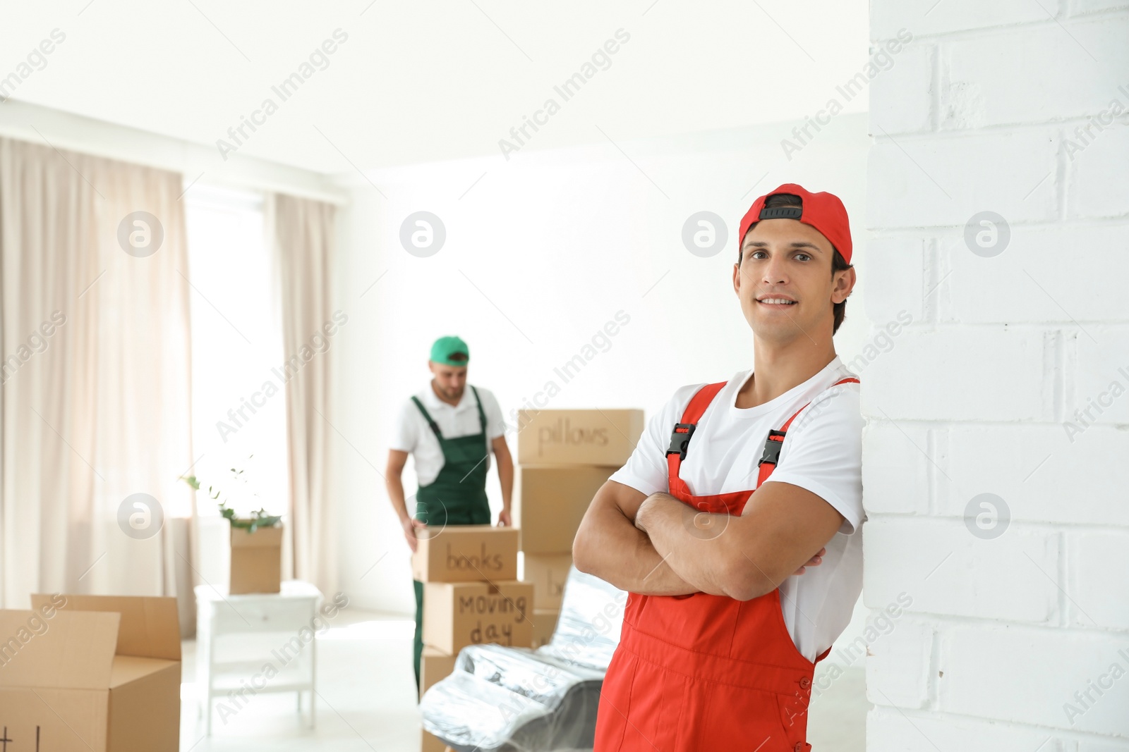 Photo of Portrait of male mover in uniform indoors