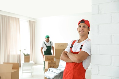 Portrait of male mover in uniform indoors