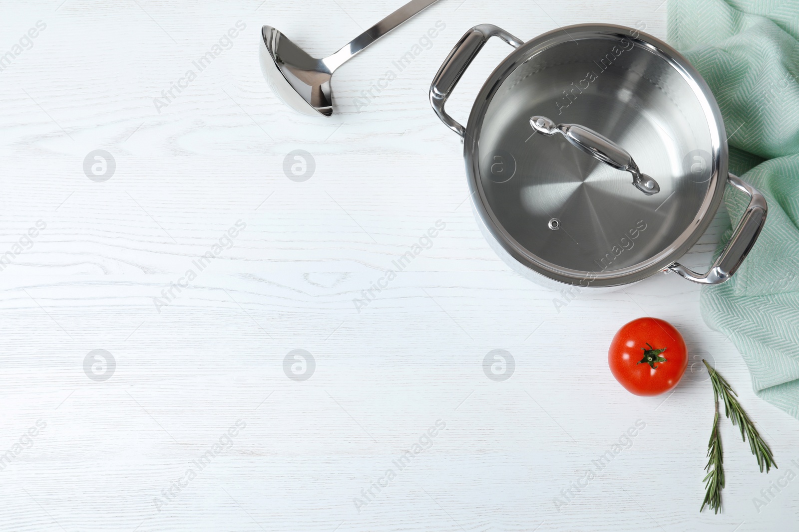 Photo of Flat lay composition with clean cookware and space for text on white wooden background