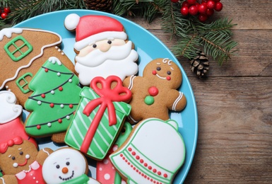 Delicious Christmas cookies on wooden table, flat lay