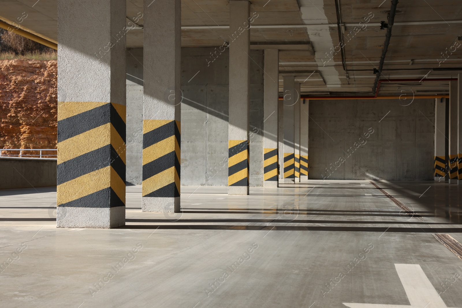 Photo of Empty open car parking garage on sunny day