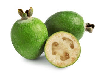 Photo of Whole and cut feijoa fruits on white background