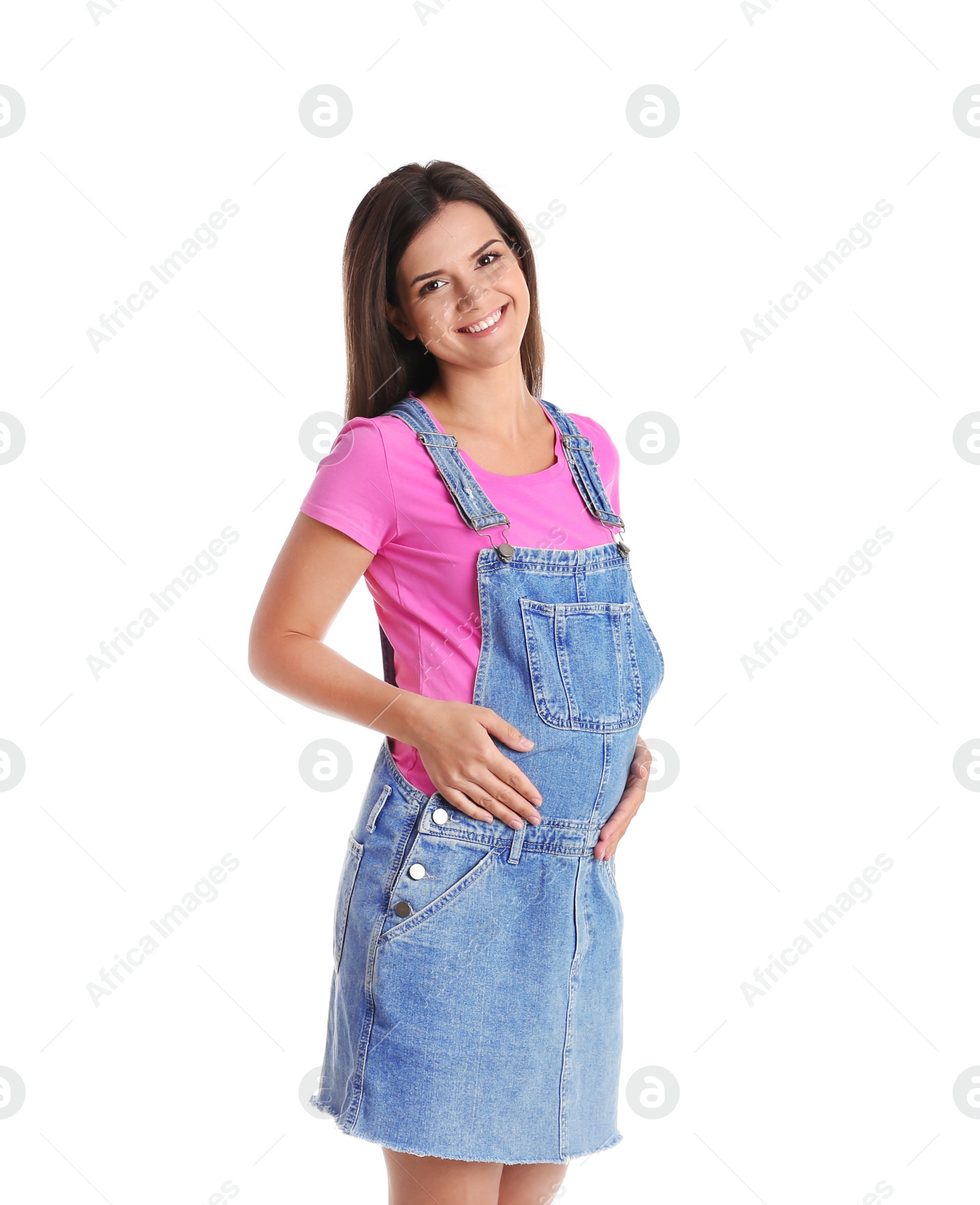 Photo of Happy pregnant woman posing on white background