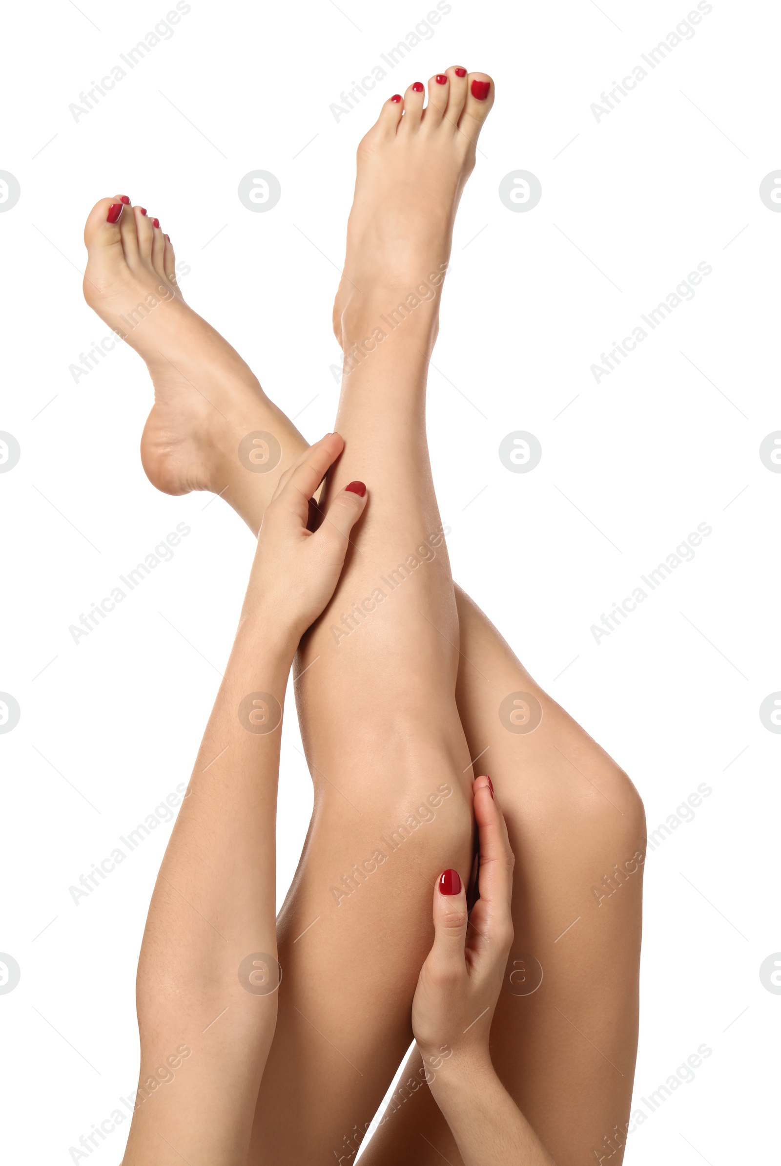 Photo of Woman with stylish red toenails after pedicure procedure isolated on white, closeup