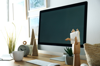 Modern computer and office supplies on wooden table, space for text. Designer's workplace