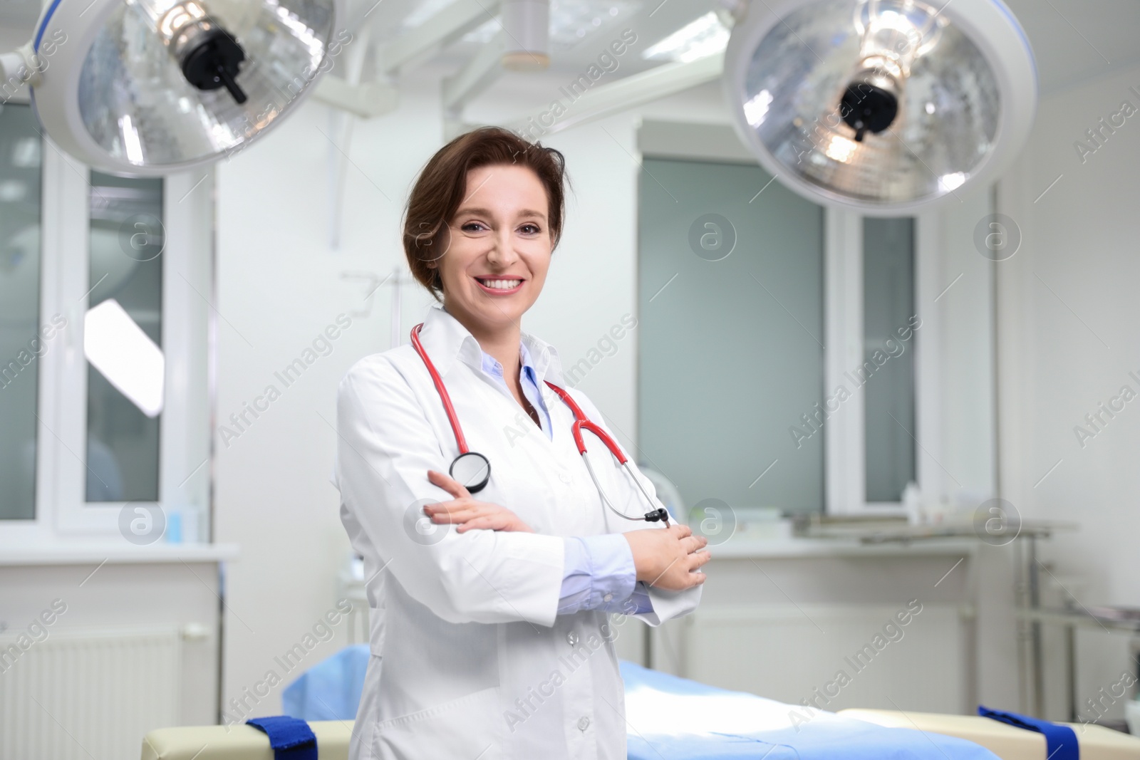 Photo of Portrait of professional doctor in modern surgery clinic. Space for text