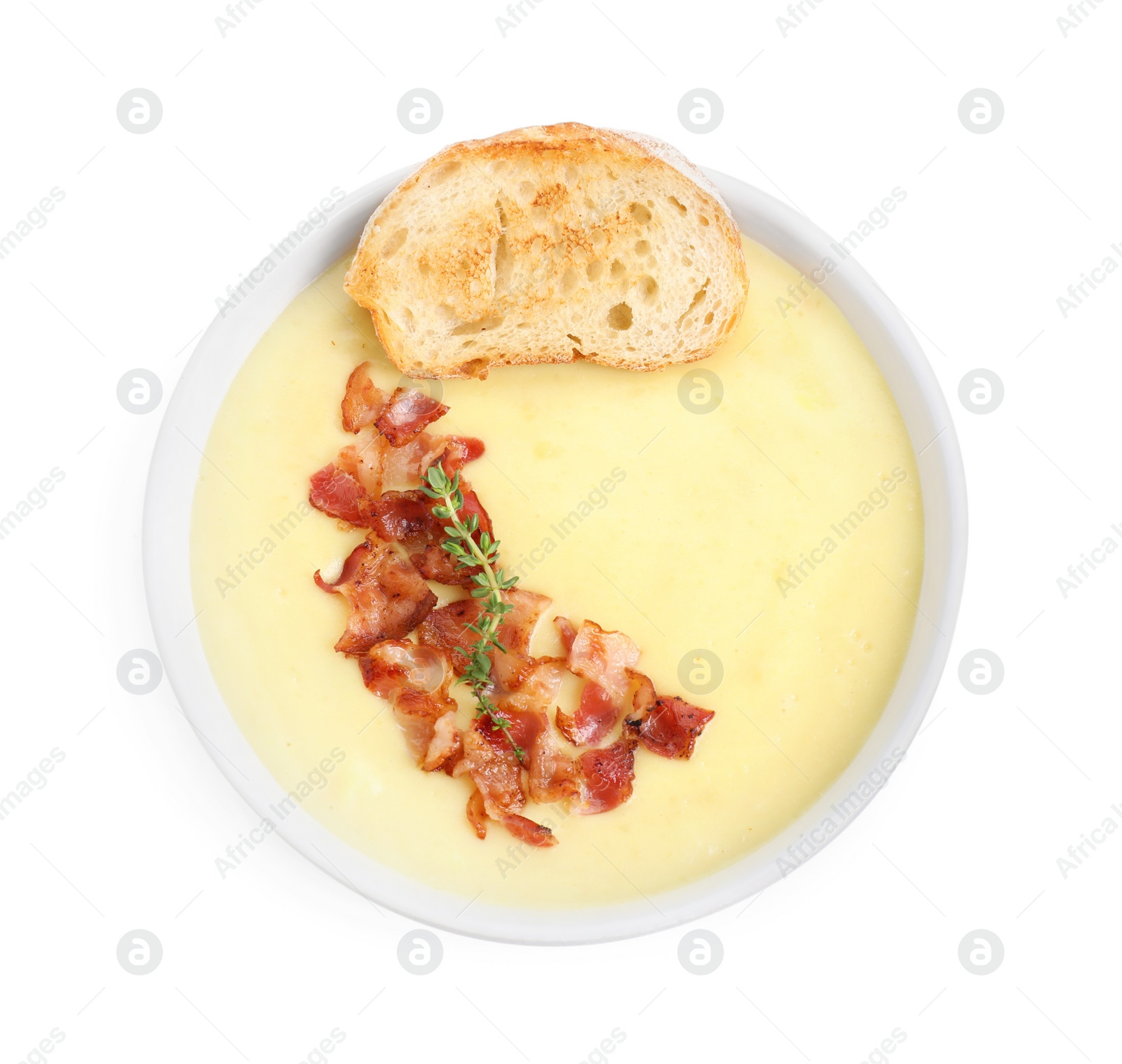 Photo of Tasty potato soup with bacon and crouton in bowl isolated on white, top view