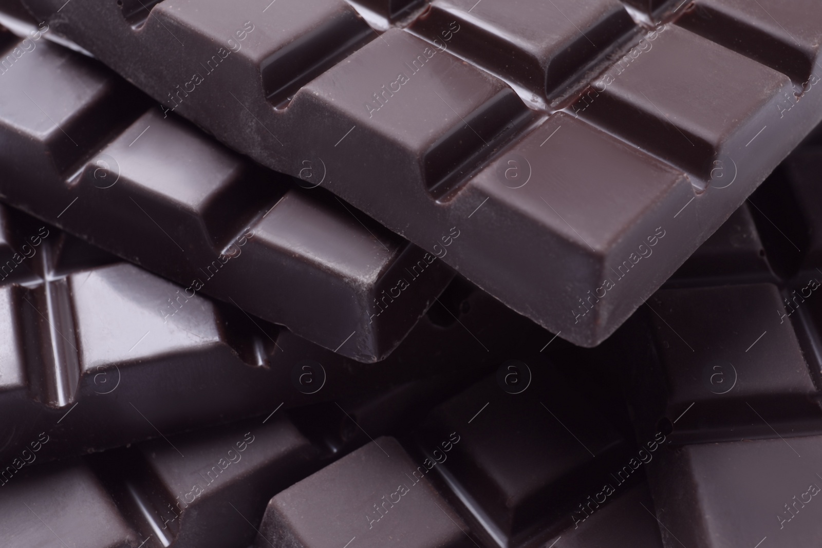 Photo of Delicious dark chocolate as background, closeup view