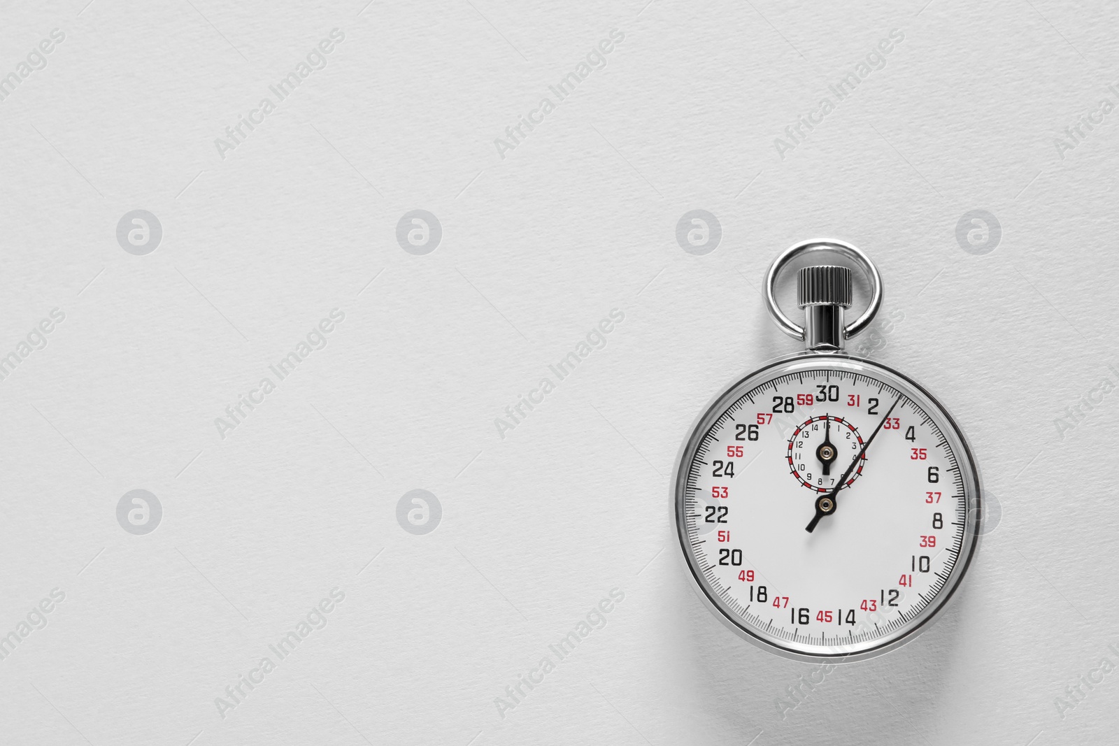 Photo of Vintage timer on light grey background, top view with space for text. Measuring tool