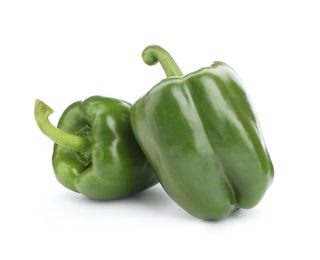 Photo of Ripe green bell peppers on white background