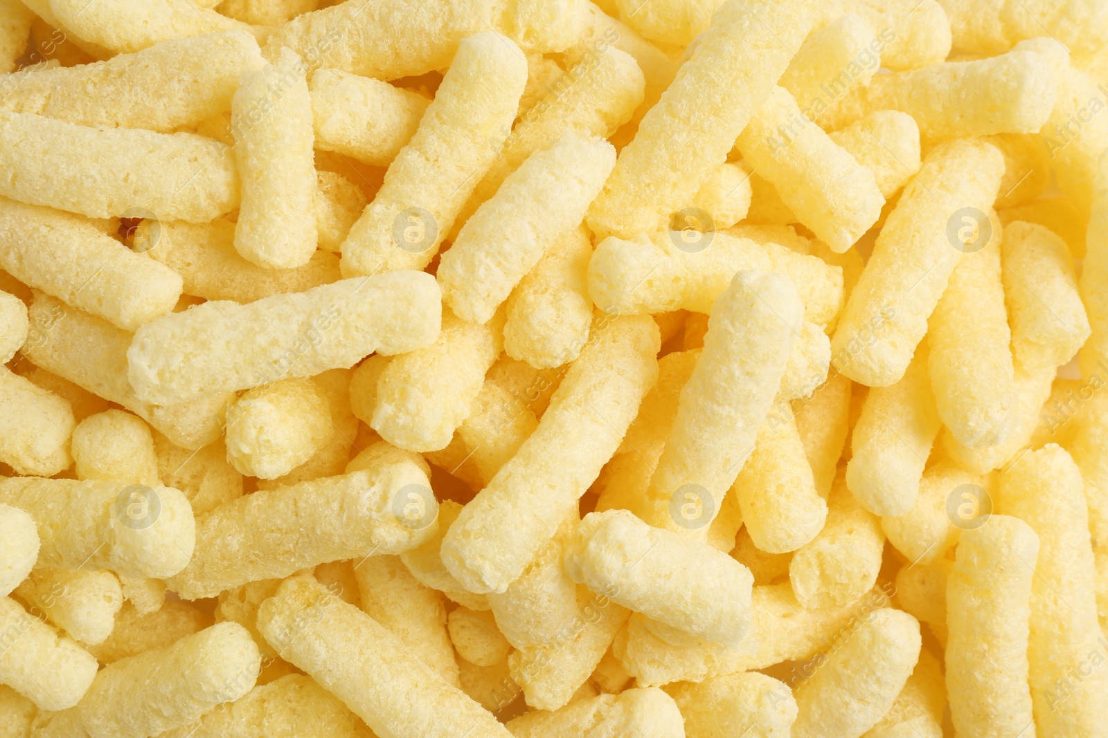 Photo of Tasty sweet corn sticks as background, top view