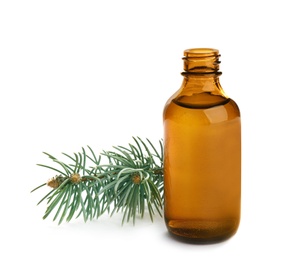 Photo of Little open bottle with essential oil and pine branch on white background