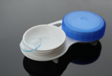 Photo of Case with contact lens on table, closeup