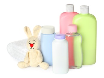 Set of baby cosmetic products, bunny toy and towel on white background