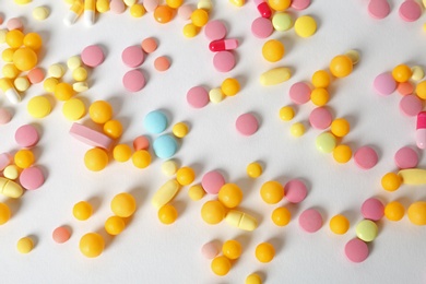 Photo of Many different pills on white background