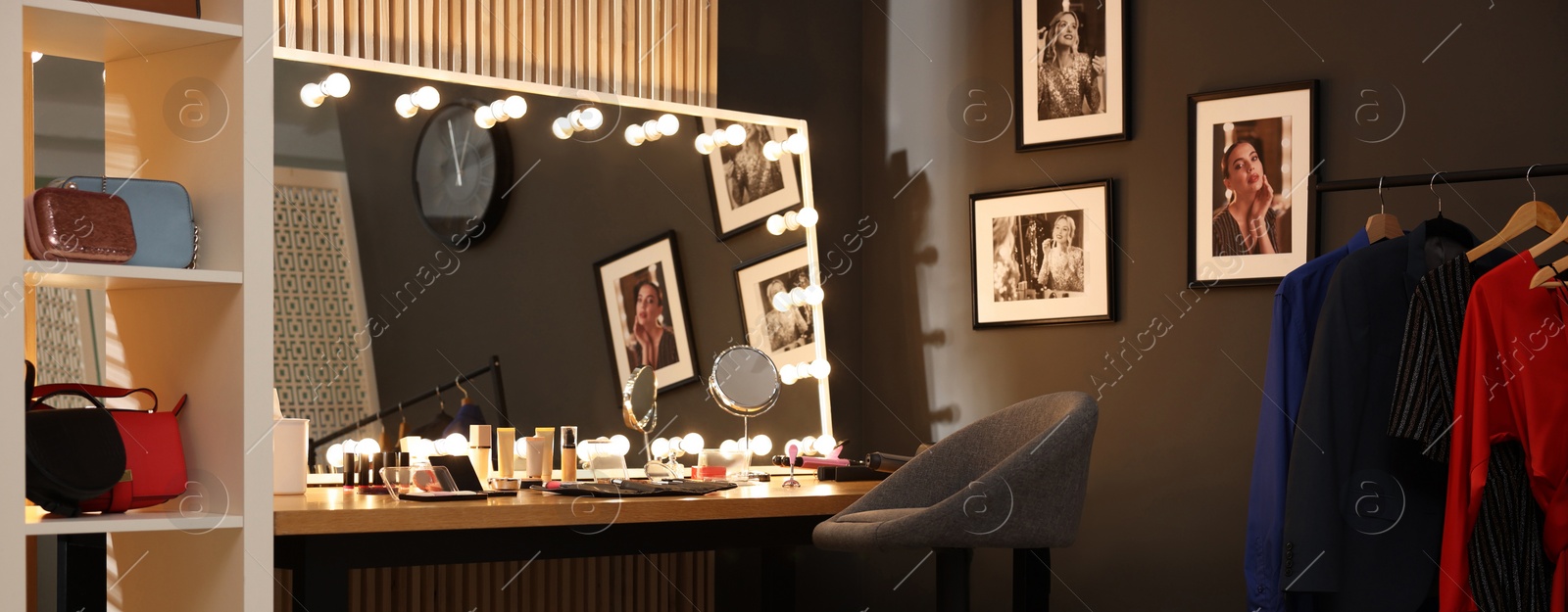 Image of Makeup room. Dressing table with mirror, clothing rack and chair indoors, banner design