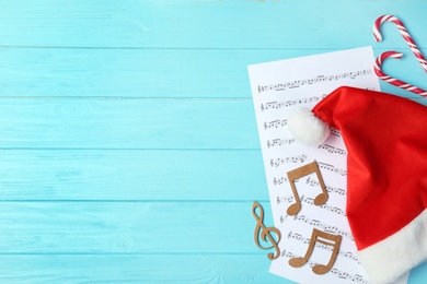 Photo of Composition with wooden music notes and space for text on table, top view