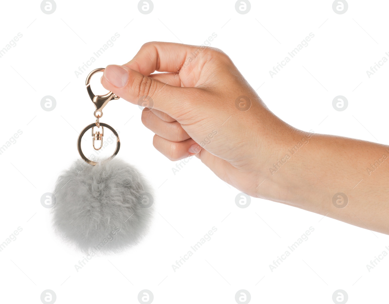 Photo of Woman holding gray faux fur keychain on white background, closeup