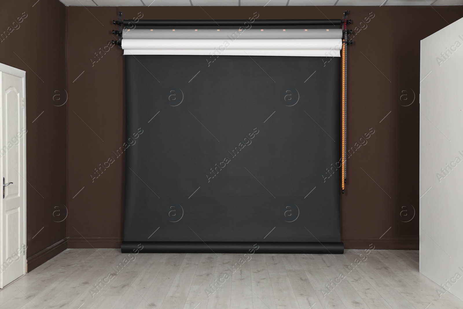 Photo of Empty black photo background. Professional studio equipment