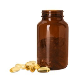 Bottle and pile of softgel capsules isolated on white