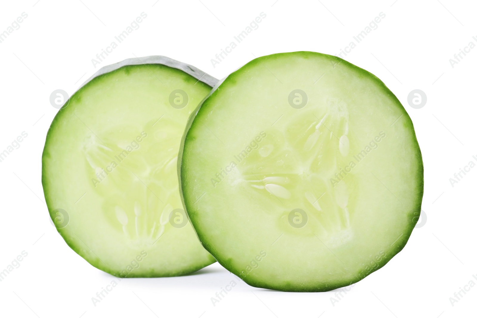 Photo of Slices of fresh cucumber on white background