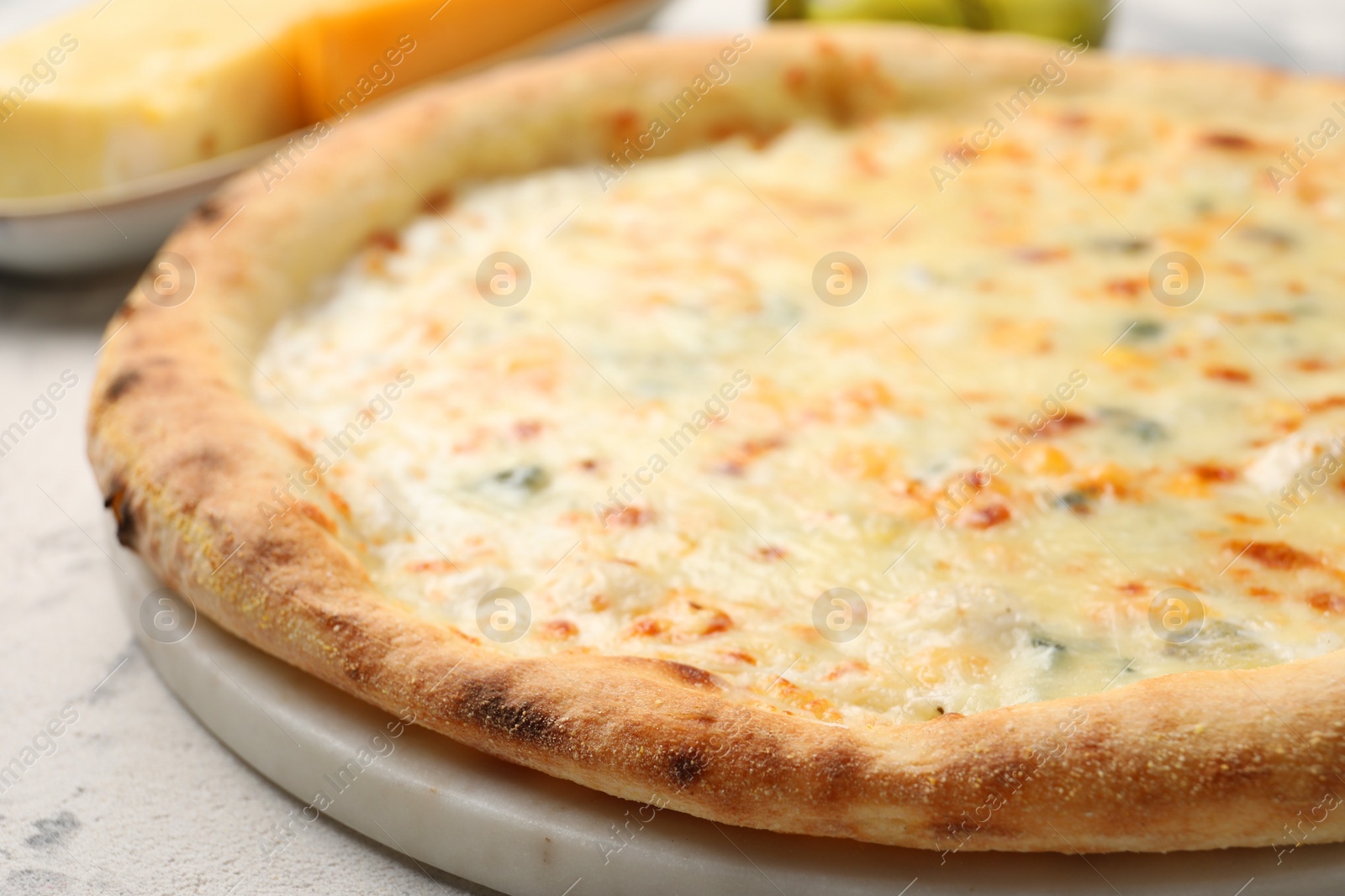 Photo of Delicious cheese pizza on table, closeup view