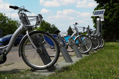 Bicycles locked to stands on city street