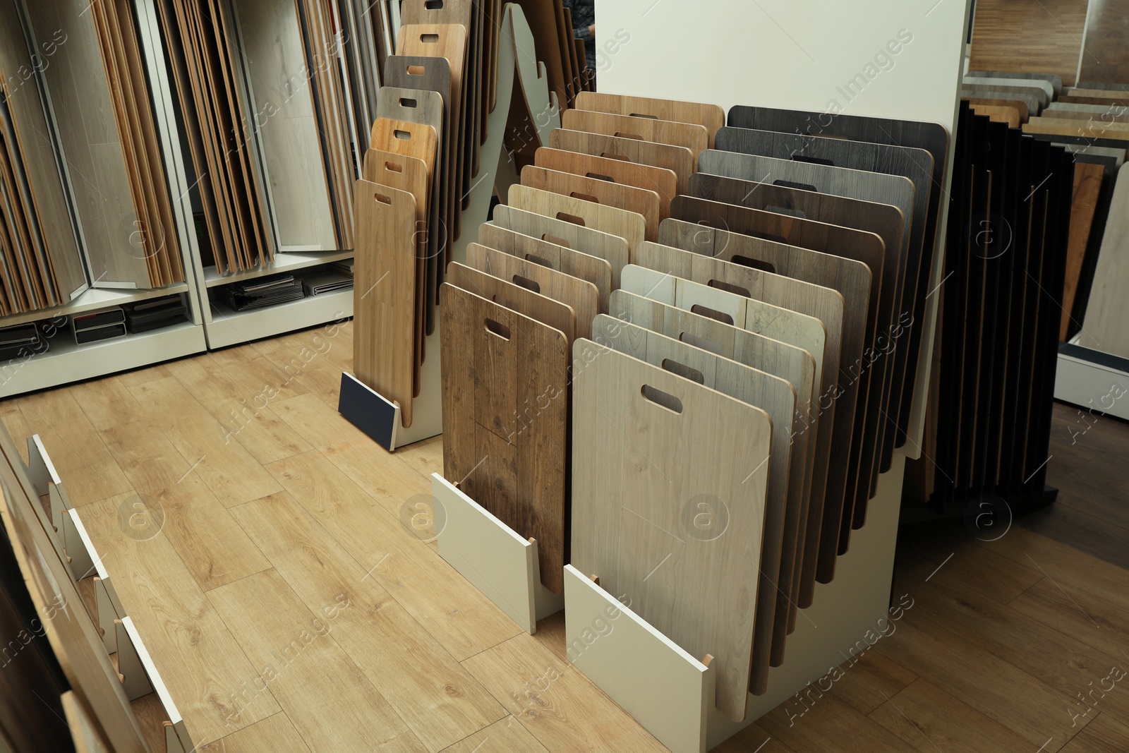 Photo of Many different samples of wooden flooring in store